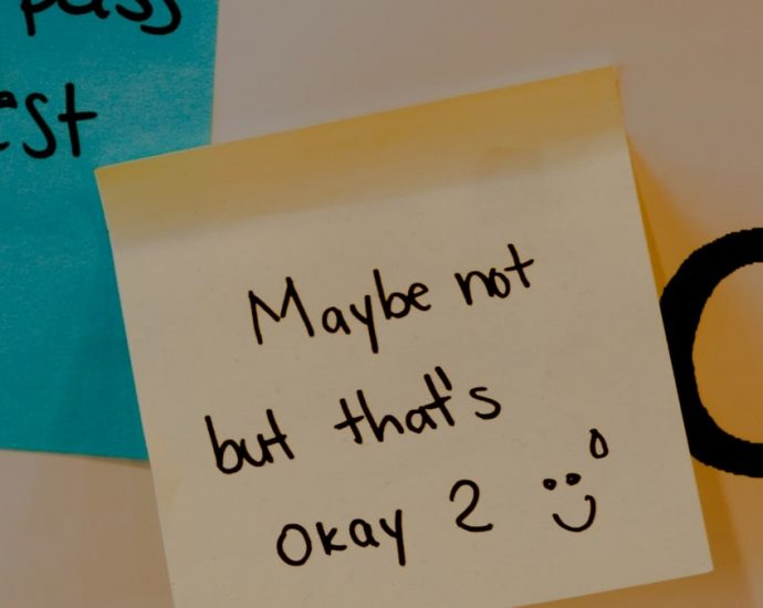 a sticky note attached to a bulletin board